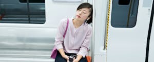 millennials-burnt-out-finances-survey Tired woman listening music and sleeping