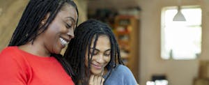 Mother and daughter using smartphone