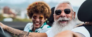 best-car-insurance-for-senior-drivers Couple sitting together in their convertible