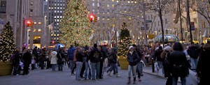 Holiday-Spending-Black-Friday A city street crowded with holiday shoppers.